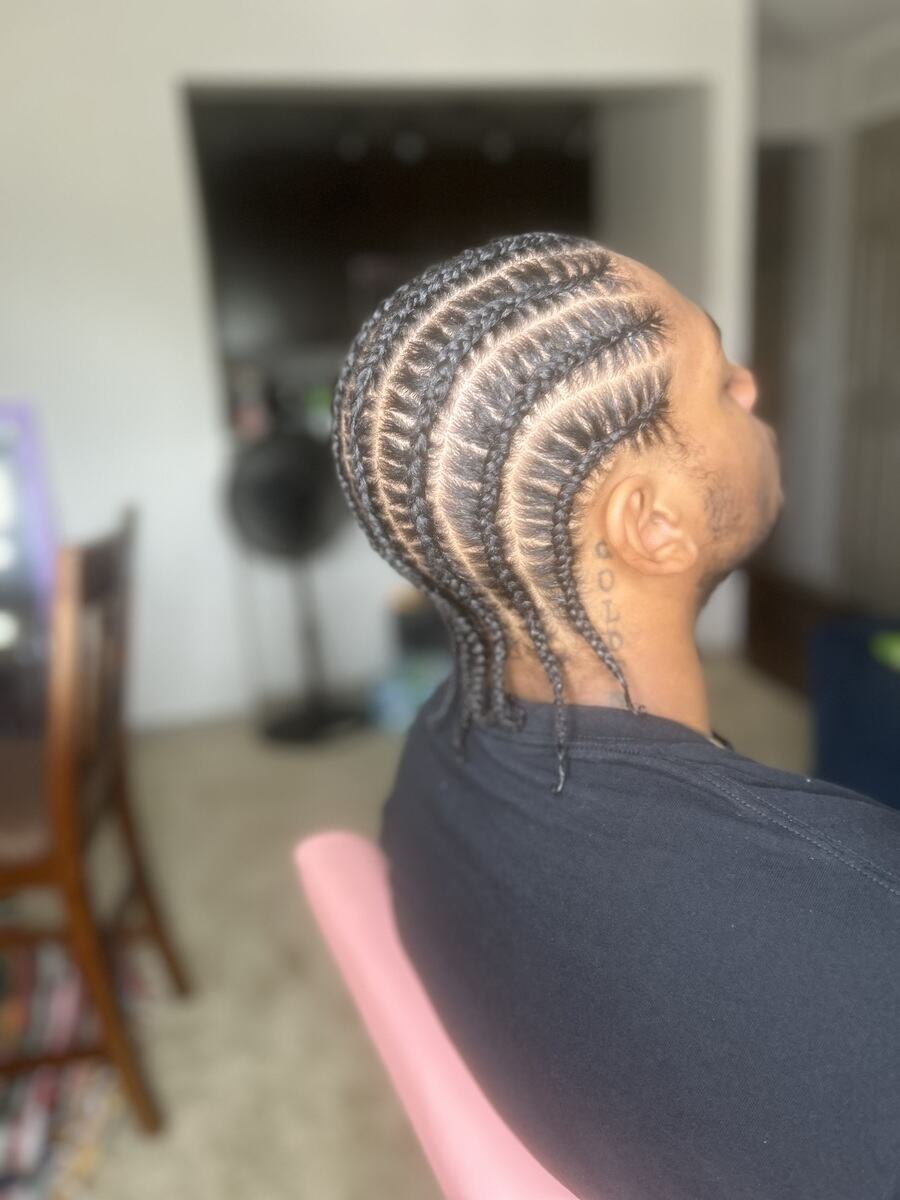 Feed-in cornrows curving back, side profile
